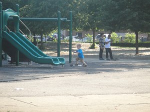 Levi shows off his scooter skills...but there is a "hidden" pole under that slide...