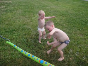 In KY, the kids beat the heat in the sprinkler.  I call this photo "Sprinkler Harlem Shake"