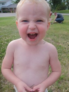 Amelia likes the sprinkler