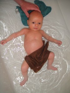 Axel LOVES the bath - this is an understatement