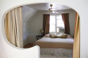 Cozy master bedroom - the curtains help keep the temperature stable - it gets cold or hot up there in the wrong season!