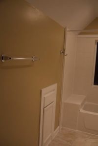 In-wall cabinet replacement and more tile work in the tub space.