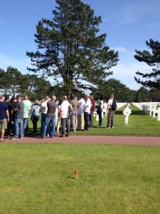 At the American Cemetery at Omaha Beach, this was a group of American service members and their spouses being given a tour.