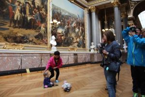 So many things to say about what is going on here.  Axel is laying on the floor, in the War Room of Versailles, while his sister kneels over him, and all of it being photographed by very sweet, very excited Asian tourists.